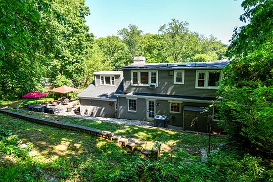 Terraced rear yard with lush vegetation