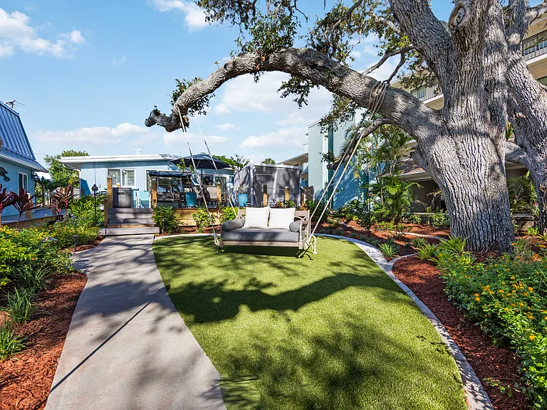 DAYBED SWING UNDER OAKS