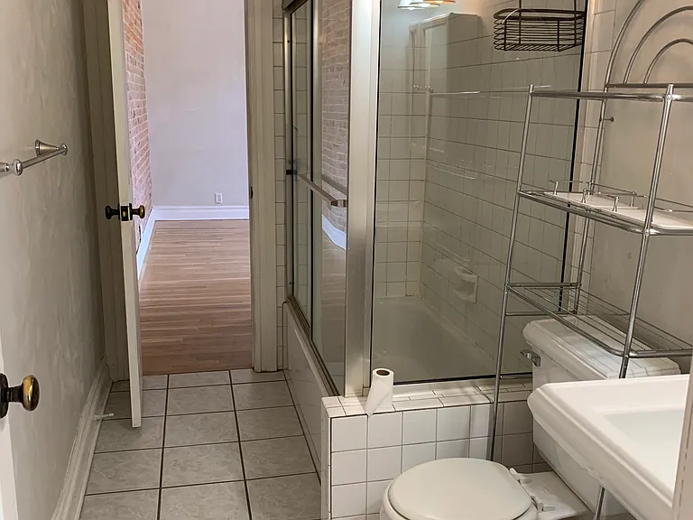 Bathroom opens into living room and main bedroom