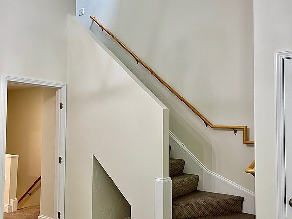 Bright and Sunny LARGE Main Bedroom with Vaulted Ceilings, Chandelier, and Staircase to Loft.