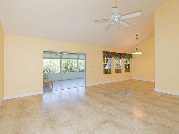 Sunroom Entrance from Living Room... Double Wide Glass Doors that fully open and close. Doors slide into wall.