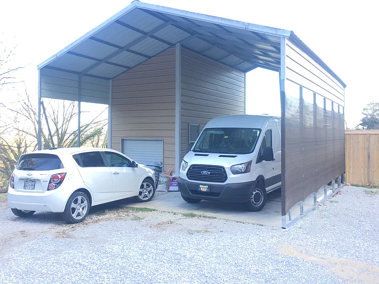 Carport and driveway. This property comfortably parks 6 cars.