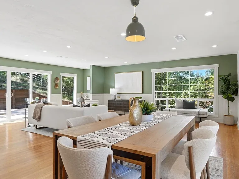 Dramatic open-concept living with walls of natural light
