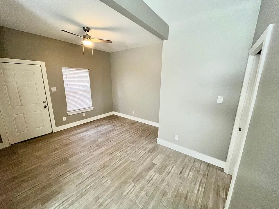 Living room and entry area, open concept to the kitchen.