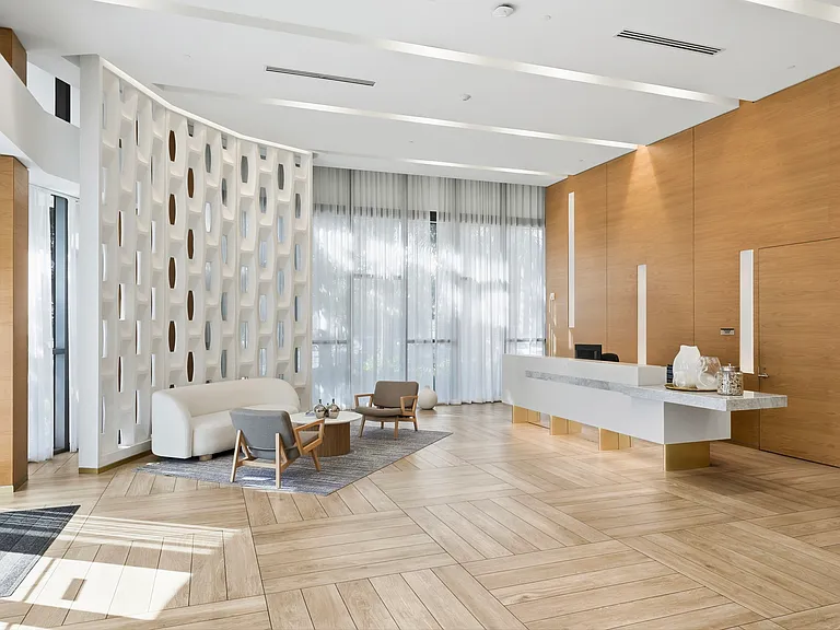 A welcoming lobby showcases modern design, soaring ceilings, and attentive service.