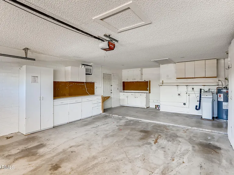 Two car garage. Now includes washer, dryer & additional fridge.