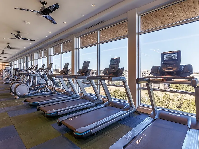 24-Hour Fitness Center with Treadmills and Cardio Equipment