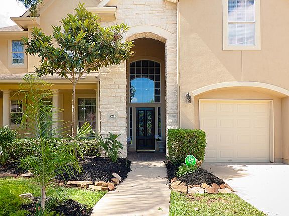 Stone elevation with green front yard