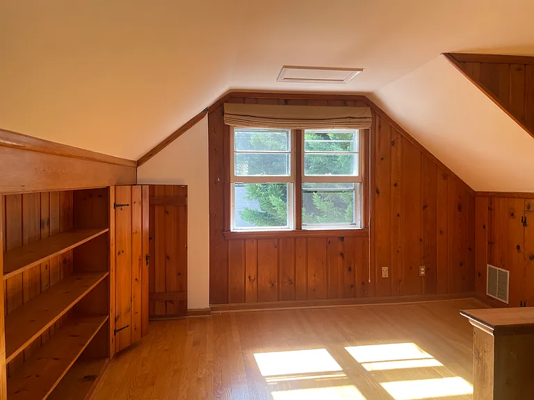 upstairs room with shelves