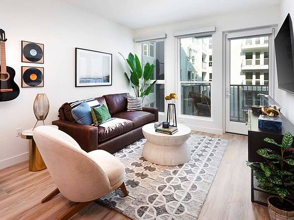 Oversized windows allow plentiful natural light while some homes include private balconies.*