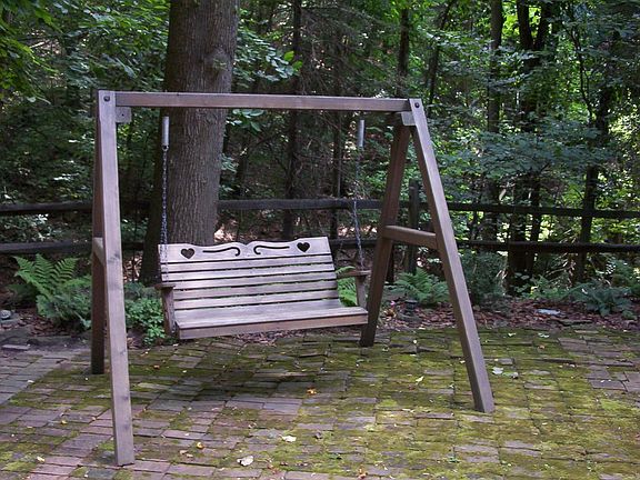 Pass your time swinging under the shade.