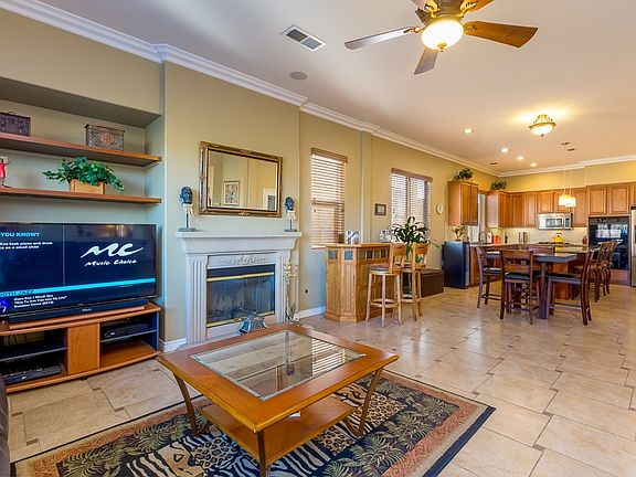 Family Room with fireplace and french door to access the backyard.