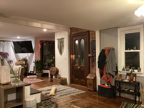 side door, "foyer", open plan from family into living