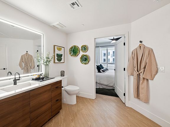 Warm wood vanity with unique bathroom layout