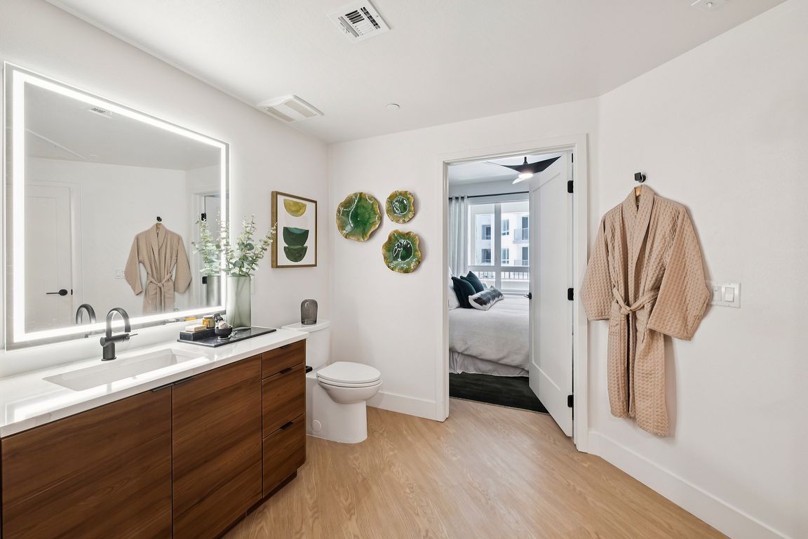 Warm wood vanity with unique bathroom layout