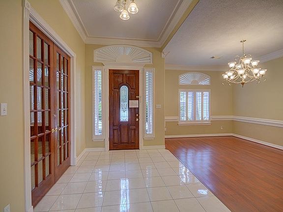 This perspective shows the foyer and formal dining room.
