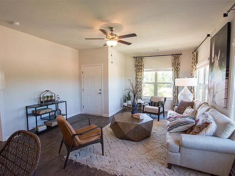 Bright, inviting living room with expansive windows.