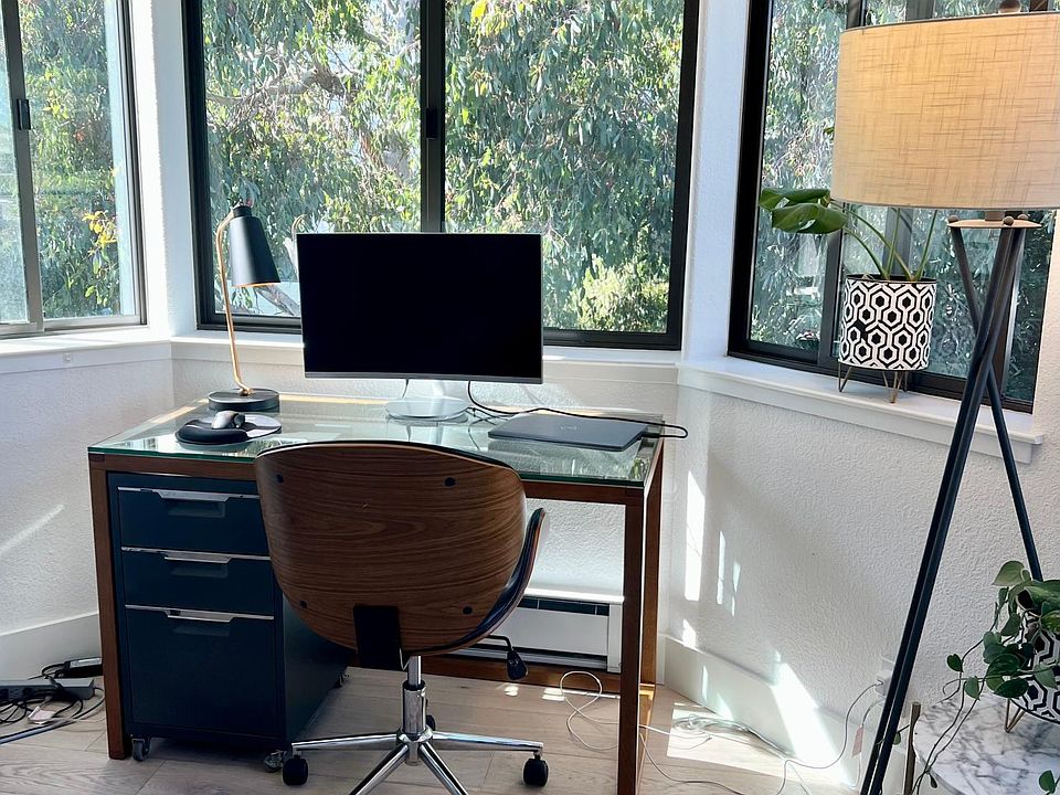 Work from home nook, with views out to the trees. No ring light needed for this seat!