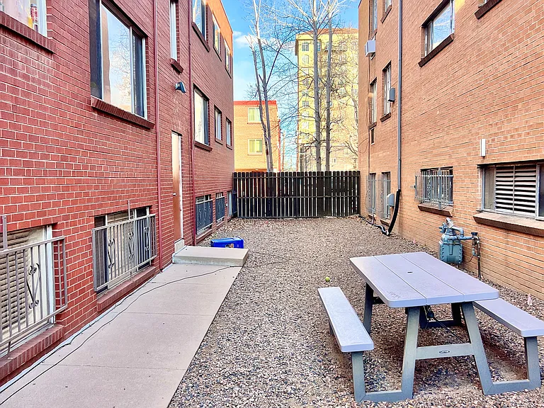 Enjoy outdoor relaxation in this delightful courtyard, perfect for gatherings.
