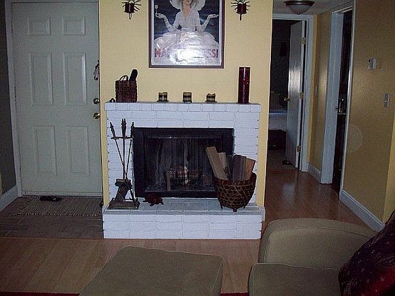 Woodburning fireplace, hardwood laminate floors.