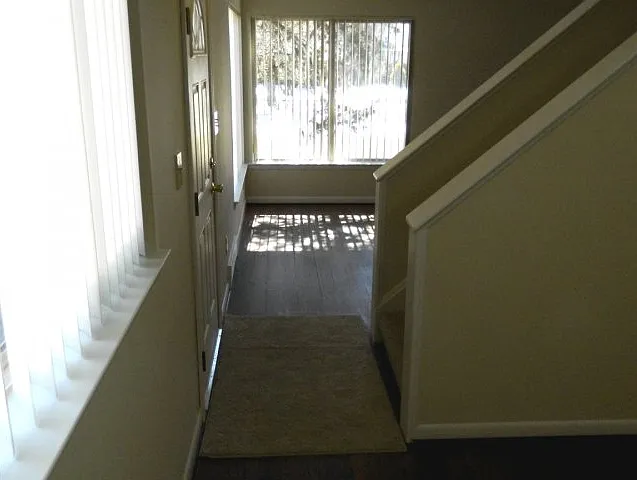 Entryway view from dining room to living room.