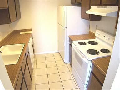 Kitchen with updated appliances and new dishwasher.