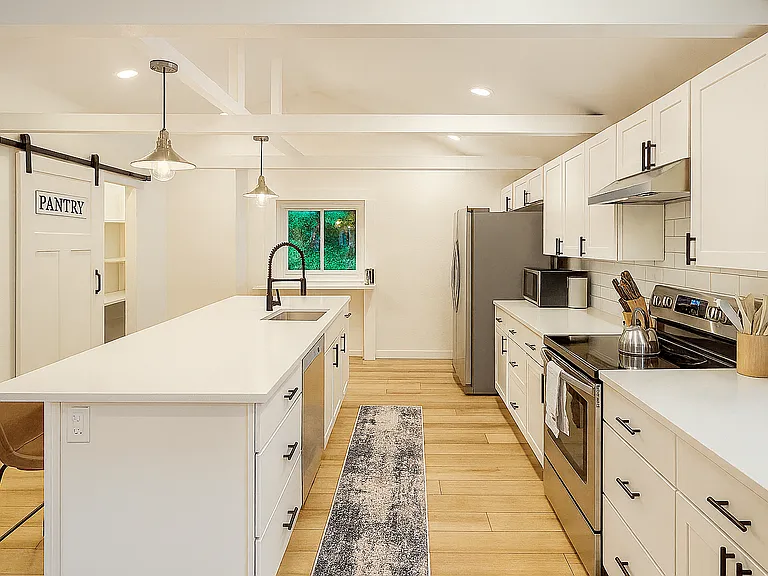 A bright, modern kitchen fully stocked for your stay