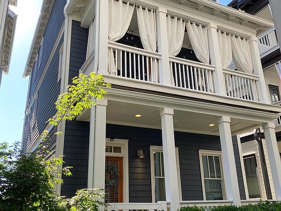 Beautiful home with double covered porches. Outdoor curtains stay with the home!