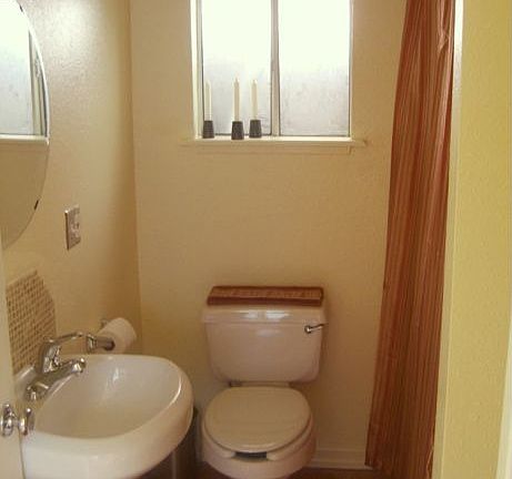 Bathroom with tub and storage
