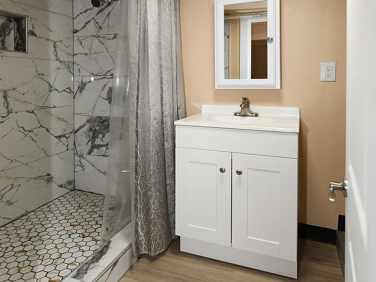 Unit B bathroom with walk in shower
