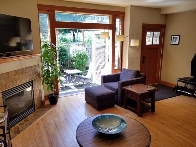 Living room staged, looking out to Burke Gilman Trail.Ride your bike to University Village or out to Magnuson park.