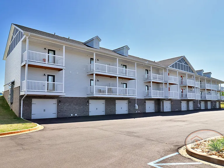 One Bedroom Stacked Apartment Homes with Balconies and Garages