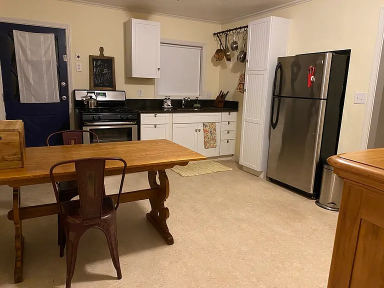 Eat in kitchen with gas stove, oven, refrigerator and garbage disposal (there is now a vent hood above the range.