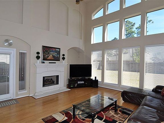 Family Room with soaring high ceilings and lots of windows for natural light.