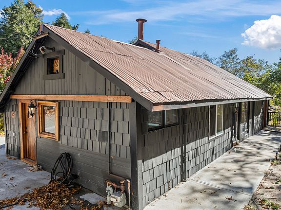 SIDE OF HOME DISPLAYING WALKING AREAS AND LEVEL YARD FOR ALL OCCASIONS