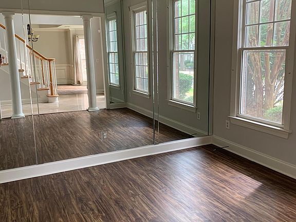 Gym room with full wall mirror