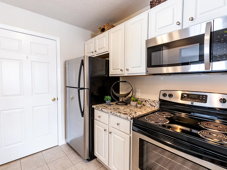 Kitchen with Must-Have Granite Countertops & Stainless Steel Appliances