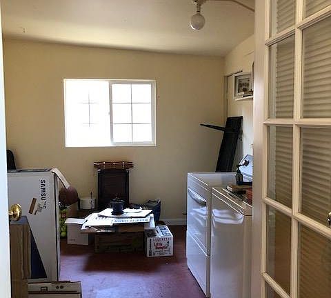 Utility room with washer/dryer hookups. (The W/D do not come with the unit.) This room has doors to both the living room and the back yard and is large enough to easily use as an office.
