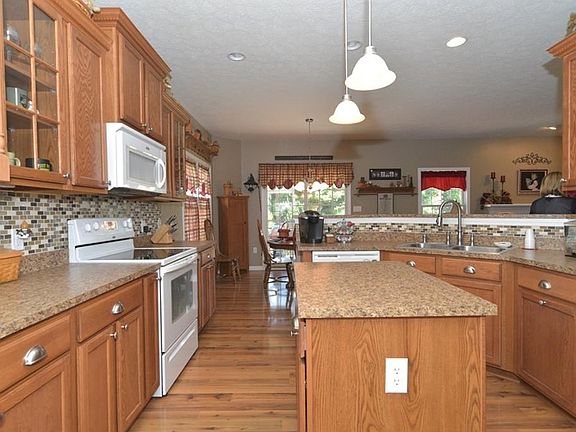 Brand new backsplash, and glass front cabinetry.