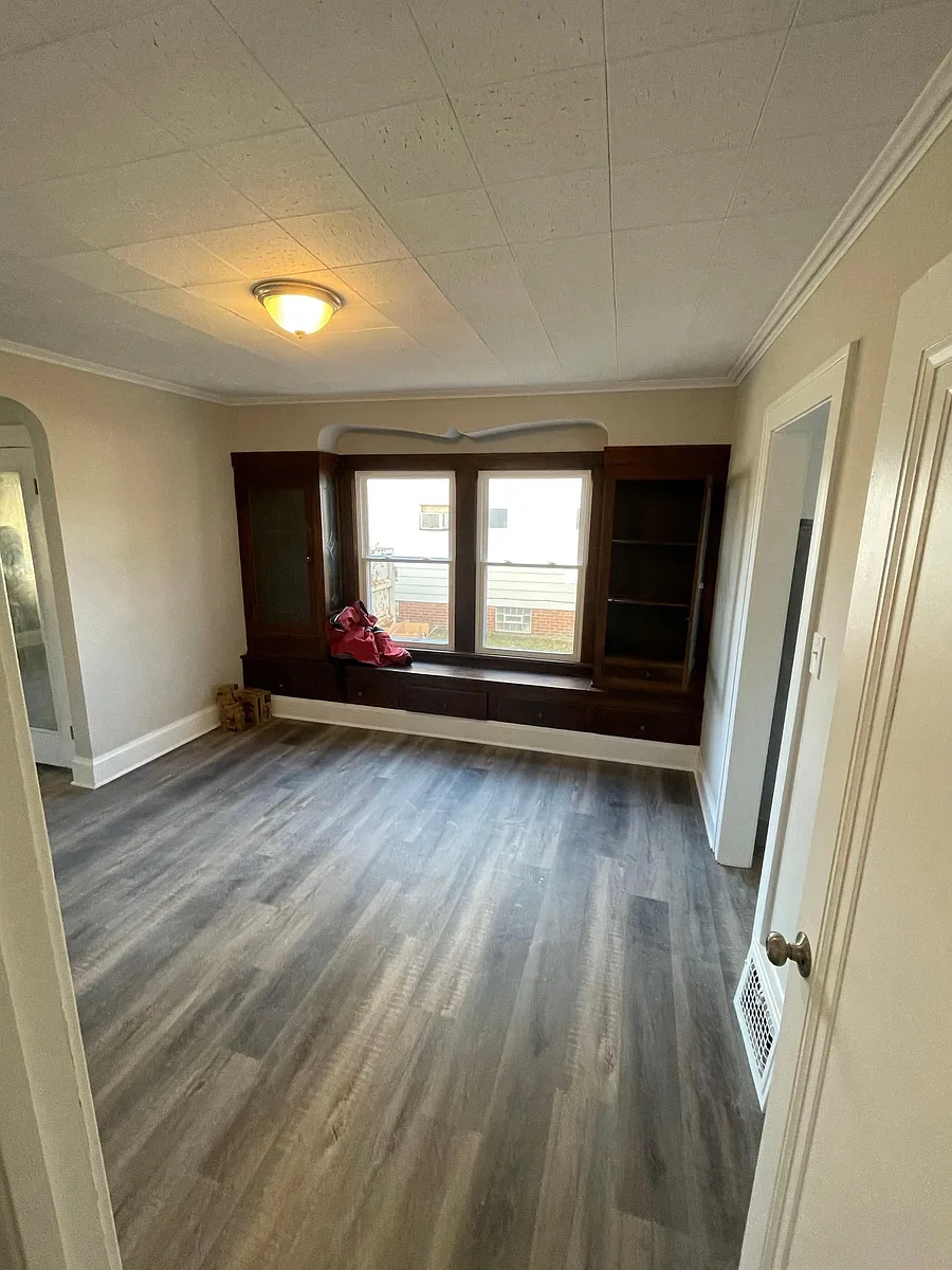 Dining room with original charm provided by the built in custom cabinetry - 4684 E 104th St #2