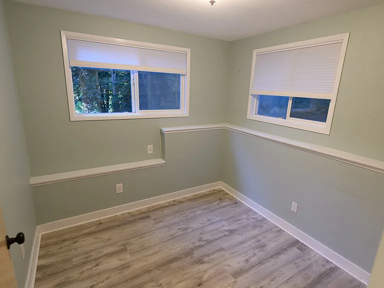 Third bedroom. When we lived in the house, my daughter loved this room because she could look out the windows from her bed and see so much nature.
