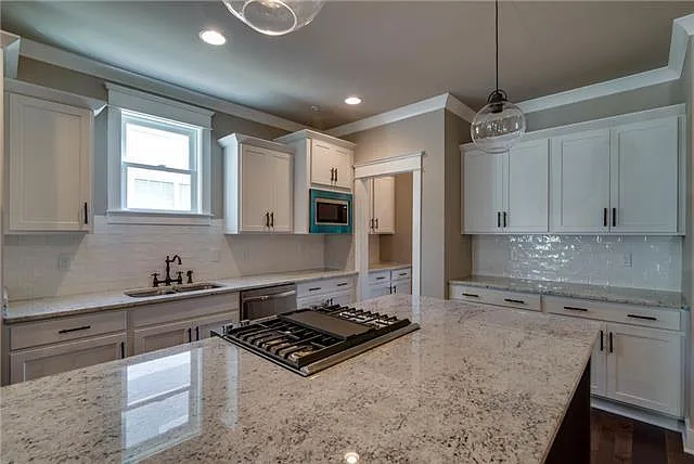 Entertainers dream kitchen. Jenn Air range in the center of the island so you can cook meals while conversing with guests.