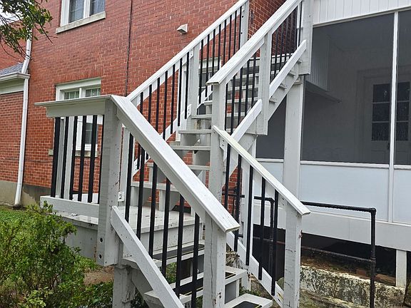 Back steps to enter screened in porch and apartment 2 back door