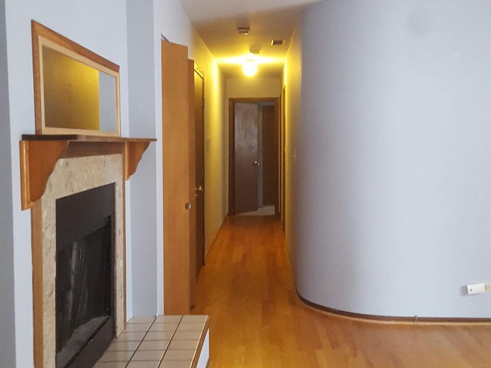 Living Room with wood-burning fireplace, towards hall bedrooms