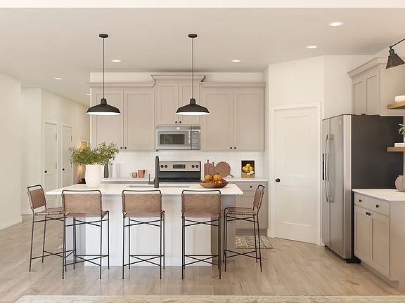 Kitchen with pendant lighting and floating shelves