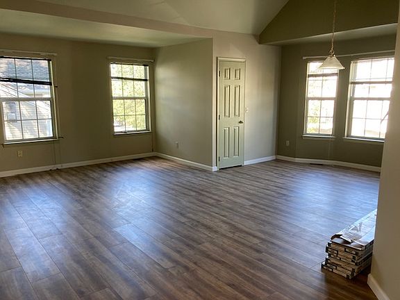 Over 400 sqft living room, dinning room combo with 6 windows, vaulted ceilings, a walk-in closet and brand new flooring.