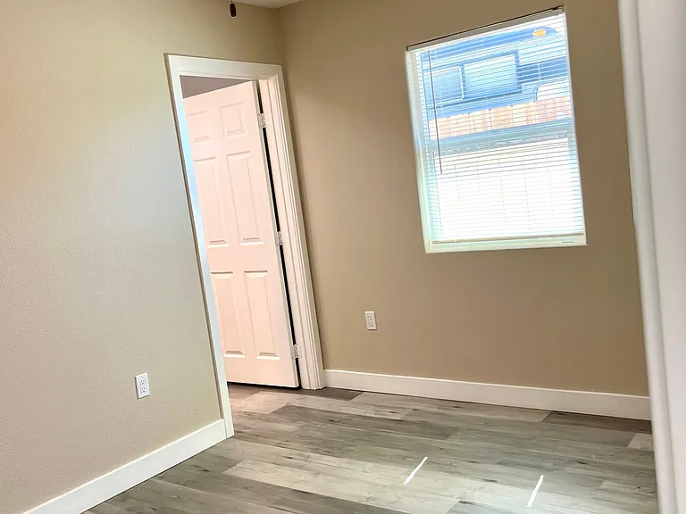 Very well lit bedroom with a window