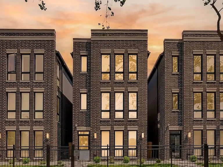 Building Exterior: New construction brick 3-flat