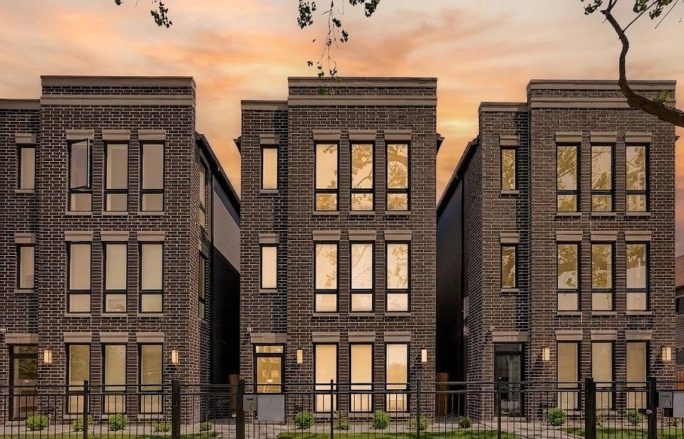 Building Exterior: New construction brick 3-flat