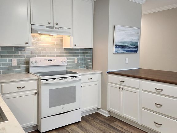 Working area of kitchen, new island with cabinets and seating
